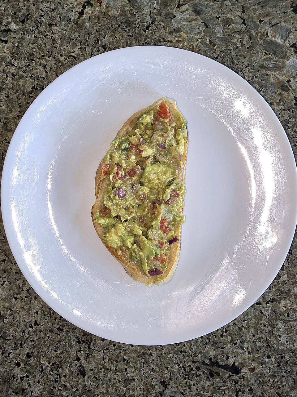 Avocado toast with tomato and lemon